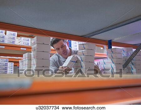 Worker picking orthopaedic medical products from store View Large Photo Image Picture - Worker picking orthopaedic medical products from store. Fotosearch