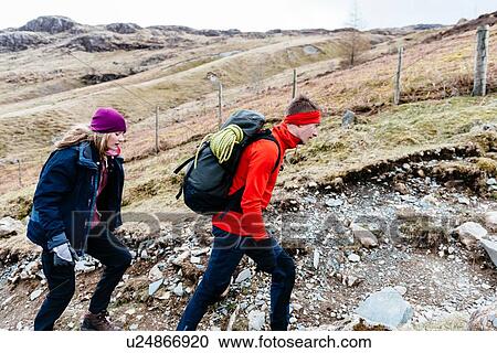 Young couple hiking, Honister Slate Mine, Keswick, Lake District, Cumbria, United Kingdom View Large Photo Image Stock Image - Young couple hiking, Honister Slate Mine, Keswick, Lake District, Cumbria, United Kingdom. Fotosearch