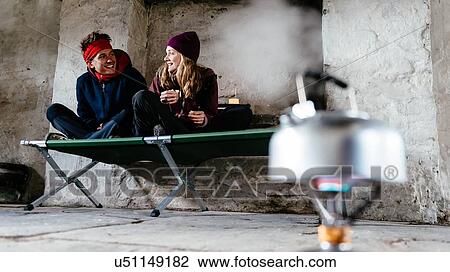Young couple hiking, in shelter for rest, Honister Slate Mine, Keswick, Lake District, Cumbria, United Kingdom View Large Photo Image Stock Image - Young couple hiking, in shelter for rest, Honister Slate Mine, Keswick, Lake District, Cumbria, United Kingdom. Fotosearch