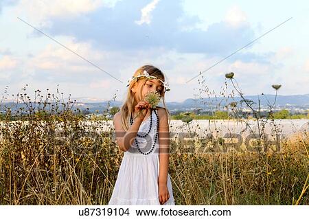Picture - Young girl celebrating spring harvest festival, Israel. Fotosearch