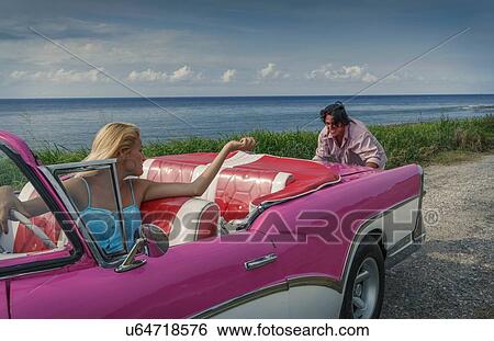Young man pushing pink vintage convertible at coast whilst girlfriend drives, Havana, Cuba View Large Photo Image Stock Photograph - Young man pushing pink vintage convertible at coast whilst girlfriend drives, Havana, Cuba. Fotosearch