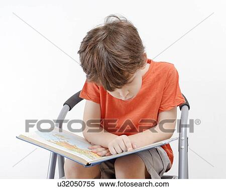Stock Photography - Investigative young boy of six. Fotosearch