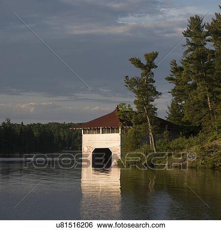 Boathouse at lakeside, Lake Of The Woods, Ontario, Canada View Large Photo Image Stock Photograph - Boathouse at lakeside, Lake Of The Woods, Ontario, Canada. Fotosearch