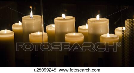 Stock Photography - Close-up of burning candles, Lake of the Woods, Ontario, Canada. Fotosearch