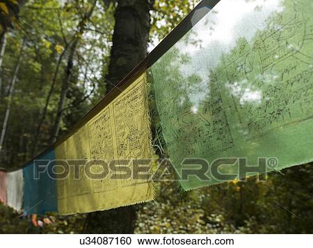 Stock Image - Close-up of prayer flags, Lake Of The Woods, Ontario, Canada. Fotosearch