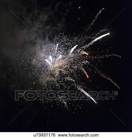 Stock Photograph - Fireworks display at night on Canada Day, Kenora, Lake Of The Woods, Ontario, Canada. Fotosearch