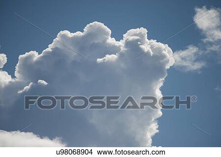 Low angle view of fluffy clouds in the sky, Lake Of The Woods, Ontario, Canada View Large Photo Image Picture - Low angle view of fluffy clouds in the sky, Lake Of The Woods, Ontario, Canada. Fotosearch