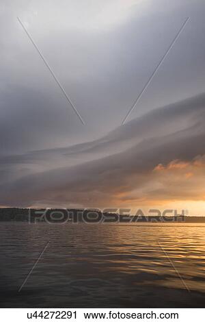Stock Image - Scenic view of lake at dusk, Lake Of The Woods, Ontario, Canada. Fotosearch