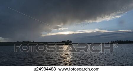 Scenic view of lake at sunrise, Lake of the Woods, Ontario, Canada View Large Photo Image Stock Photo - Scenic view of lake at sunrise, Lake of the Woods, Ontario, Canada. Fotosearch