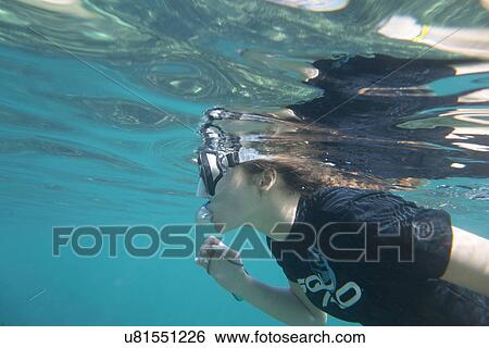 Stock Photograph - Underwater view of a diver snorkeling, Zihuatanejo, Guerrero, Mexico. Fotosearch