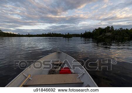 View of boat in a lake, Lake Of The Woods, Ontario, Canada View Large Photo Image Stock Image - View of boat in a lake, Lake Of The Woods, Ontario, Canada. Fotosearch