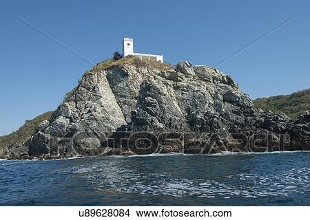 Picture - View of building on top of a cliff, Ixtapa, Guerrero, Mexico. Fotosearch