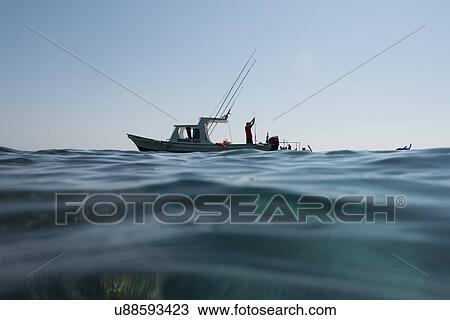 View of fishing boat at sea, Ixtapa, Zihuatanejo, Guerrero, Mexico View Large Photo Image Stock Image - View of fishing boat at sea, Ixtapa, Zihuatanejo, Guerrero, Mexico. Fotosearch