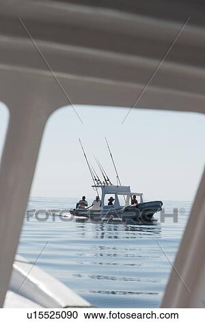 View of people fishing in a boat on the ocean, Ixtapa, Zihuatanejo, Guerrero, Mexico View Large Photo Image Stock Image - View of people fishing in a boat on the ocean, Ixtapa, Zihuatanejo, Guerrero, Mexico. Fotosearch