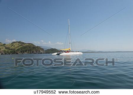 Stock Image - View of sailboat at sea, Ixtapa, Zihuatanejo, Guerrero, Mexico. Fotosearch