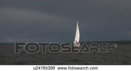 View of sailboat on the lake, Lake of the Woods, Ontario, Canada View Large Photo Image Stock Photo - View of sailboat on the lake, Lake of the Woods, Ontario, Canada. Fotosearch