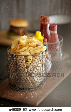 Basket of onion rings View Large Photo Image Stock Image - Basket of onion rings. Fotosearch