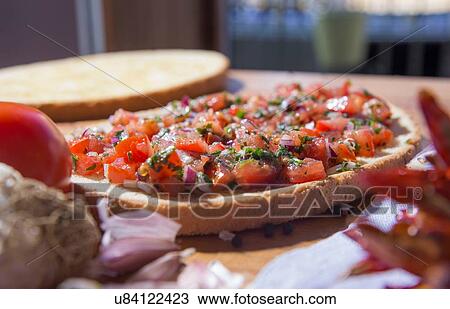 Bread with chopped vegetables and herbs on kitchen counter View Large Photo Image Stock Image - Bread with chopped vegetables and herbs on kitchen counter. Fotosearch