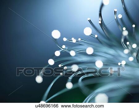 Bundles of illuminated optical fibres used to carry high volumes of data View Large Photo Image Stock Photograph - Bundles of illuminated optical fibres used to carry high volumes of data. Fotosearch