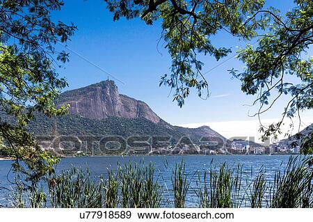 Stock Photo - "Christ the redeemer statue on Corcovado, view across lagoa rodrigo de freitas, Rio De Janeiro, Brazil". Fotosearch