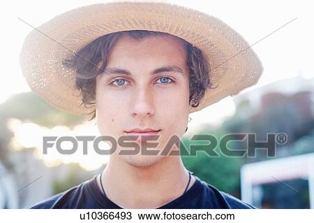Close up portrait of young man wearing sunhat at beach View Large Photo Image Stock Image - Close up portrait of young man wearing sunhat at beach. Fotosearch