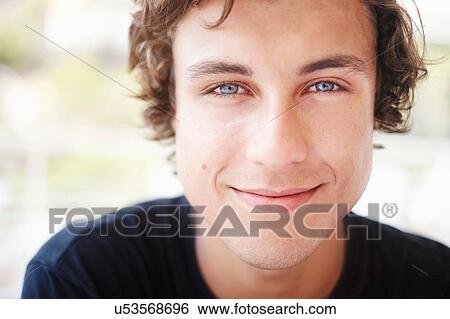 Close up portrait of young man with blue eyes View Large Photo Image Stock Photograph - Close up portrait of young man with blue eyes. Fotosearch
