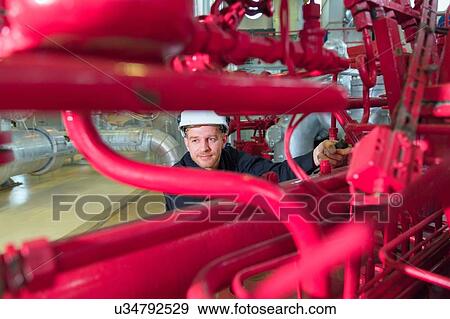 Stock Photo - Engineer inspection in geothermal power station. Fotosearch