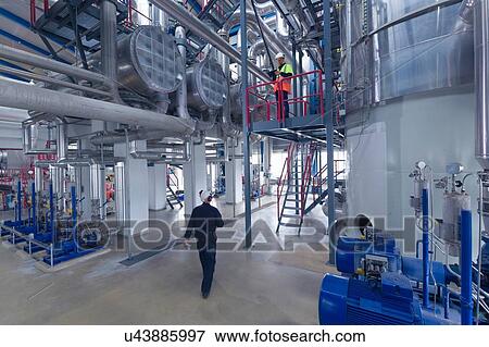Engineers at work in geothermal power station View Large Photo Image Stock Photo - Engineers at work in geothermal power station. Fotosearch