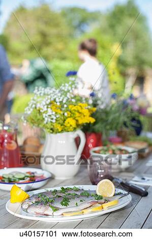 "Family enjoying meal, outdoors" View Large Photo Image Stock Image - "Family enjoying meal, outdoors". Fotosearch