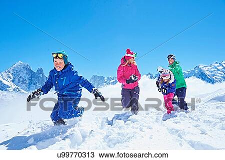 "Family having snowball fight, Chamonix, France" View Large Photo Image Stock Image - "Family having snowball fight, Chamonix, France". Fotosearch