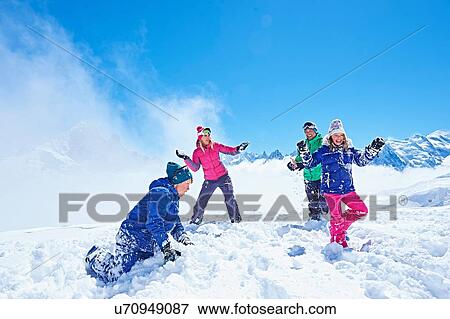 "Family having snowball fight, Chamonix, France" View Large Photo Image Stock Photo - "Family having snowball fight, Chamonix, France". Fotosearch