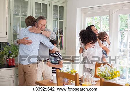"Family, hugging, in kitchen" View Large Photo Image Stock Image - "Family, hugging, in kitchen". Fotosearch