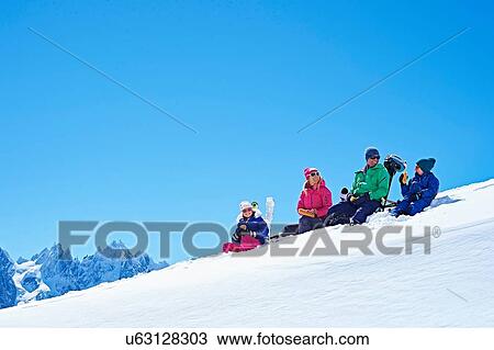 "Family resting on snow, Chamonix, France" View Large Photo Image Stock Image - "Family resting on snow, Chamonix, France". Fotosearch