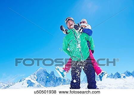 "Father giving daughter piggyback ride, Chamonix, France" View Large Photo Image Stock Photo - "Father giving daughter piggyback ride, Chamonix, France". Fotosearch
