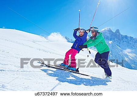"Father guiding daughter to ski, Chamonix, France" View Large Photo Image Stock Photo - "Father guiding daughter to ski, Chamonix, France". Fotosearch