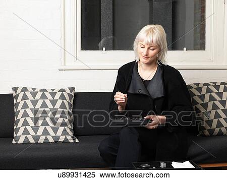 Female jeweler looking at ring in jewellery shop View Large Photo Image Stock Photography - Female jeweler looking at ring in jewellery shop. Fotosearch