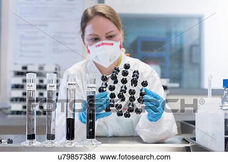 Female scientist with graphene nano material molecular model in graphene processing factory View Large Photo Image Stock Photo - Female scientist with graphene nano material molecular model in graphene processing factory. Fotosearch