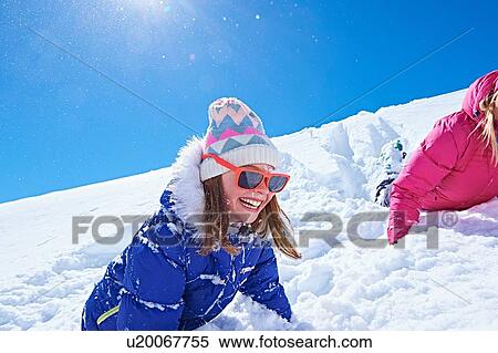 "Girl playing in snow, Chamonix, France" View Large Photo Image Stock Photography - "Girl playing in snow, Chamonix, France". Fotosearch