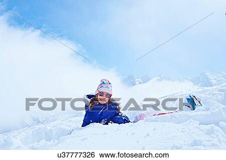 "Girl sitting in snow, Chamonix, France" View Large Photo Image Stock Photograph - "Girl sitting in snow, Chamonix, France". Fotosearch