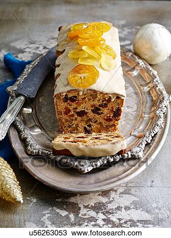Glazed Chile Pan De Pascua with orange slices on silver serving dish with christmas baubles View Large Photo Image Stock Image - Glazed Chile Pan De Pascua with orange slices on silver serving dish with christmas baubles. Fotosearch