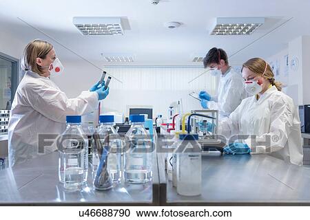 Stock Image - Graphene sample quality control in graphene processing factory. Fotosearch