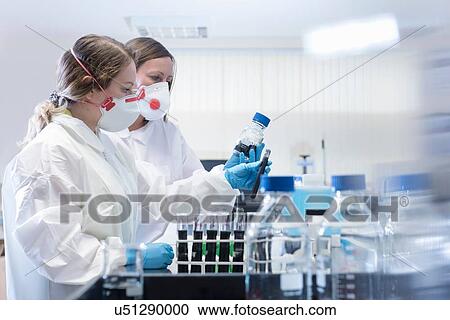 Stock Image - Graphene sample quality control in graphene processing factory. Fotosearch