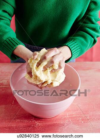 High angle view of mid adult womans mid section bringing togther dough in pink mixing bowl View Large Photo Image Stock Photography - High angle view of mid adult womans mid section bringing togther dough in pink mixing bowl. Fotosearch