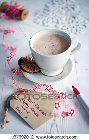 Stock Image - "Hot chocolate, cookie and gift tag". Fotosearch