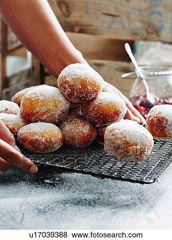 Stock Photo - "Jam filled doughnuts, close-up". Fotosearch