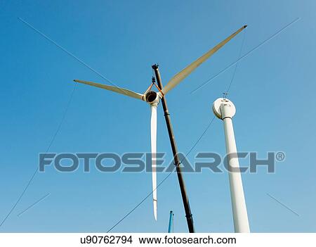 Low angle view of wind turbine being dismantled View Large Photo Image Picture - Low angle view of wind turbine being dismantled. Fotosearch