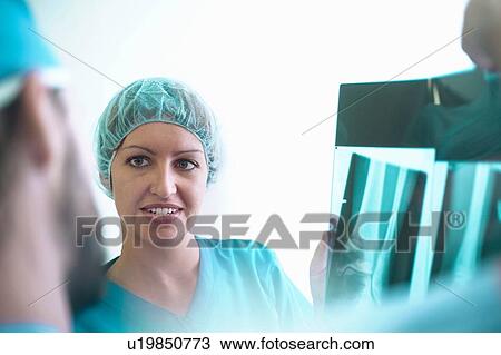 Male and female orthopedic surgeons discussing x-ray images View Large Photo Image Stock Image - Male and female orthopedic surgeons discussing x-ray images. Fotosearch