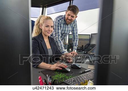 Man and woman working in air traffic control View Large Photo Image Stock Image - Man and woman working in air traffic control. Fotosearch