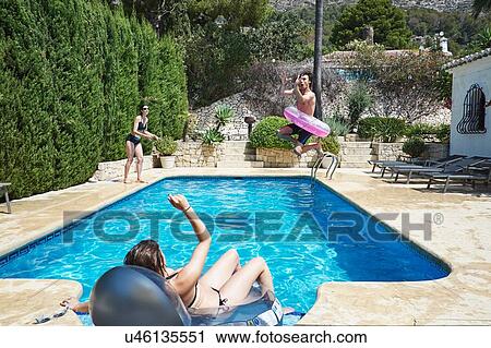Mature woman with son and daughter playing in apartment swimming pool View Large Photo Image Stock Image - Mature woman with son and daughter playing in apartment swimming pool. Fotosearch