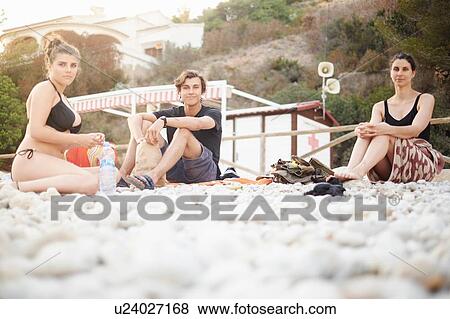 "Mature woman with son and daughter sitting on beach, Javea, Spain" View Large Photo Image Stock Photo - "Mature woman with son and daughter sitting on beach, Javea, Spain". Fotosearch